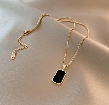 Stylish black stone with gold chain